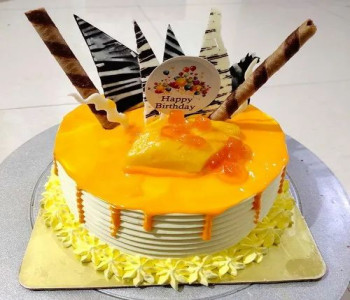 Mango dripping Cream Cake Half Kg